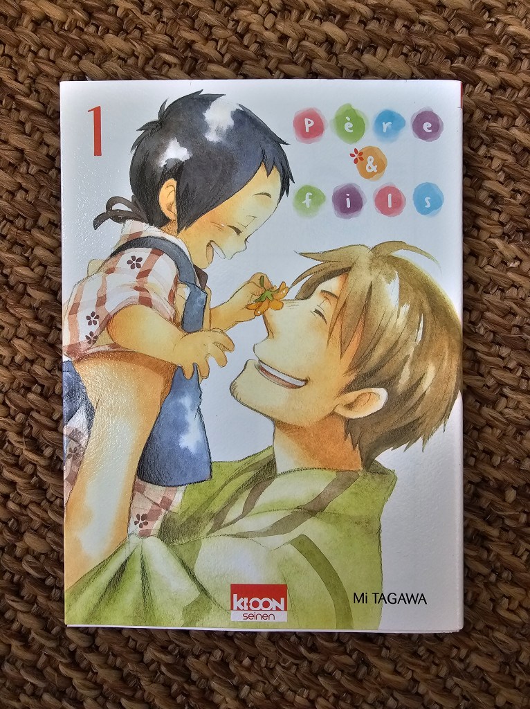 Couverture du manga 'Père & Fils' présentant un père et son jeune fils partageant un moment complice, avec un dessin coloré et chaleureux.